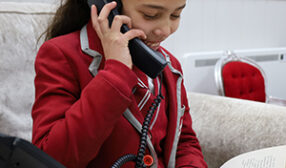 Student talking on the telephone.