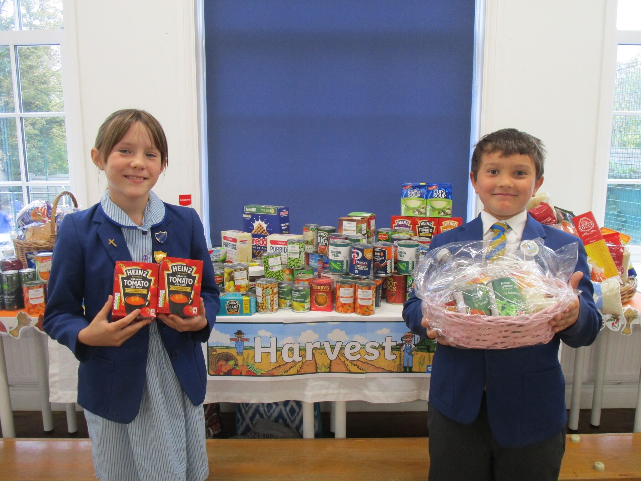 Photo of children in school uniform with food hub gifts