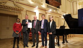 Staff with students of New Hall School