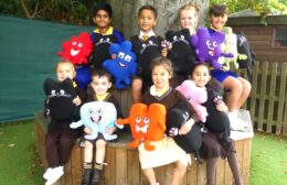 P1050279 Photo of children holding Jigsaw puzzle pieces